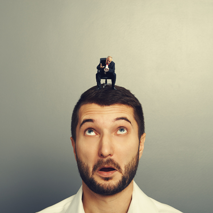 businessman looking at small senior boss